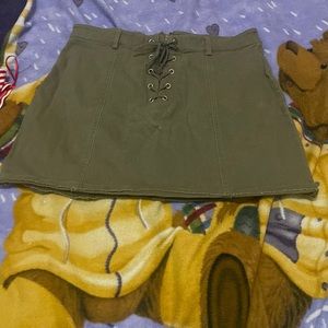 Army green skirt , Zip up and strings , size SMALL
